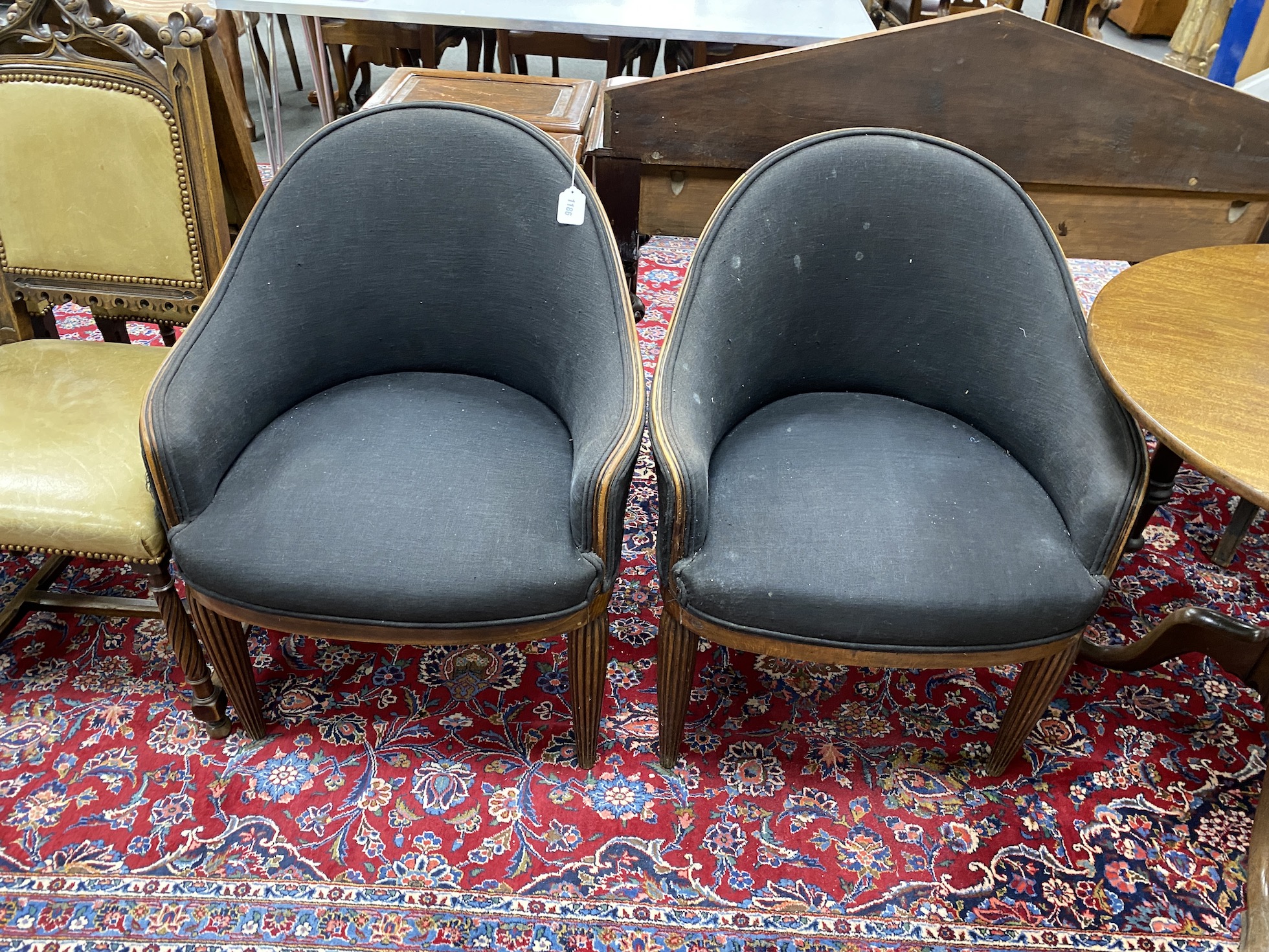 A pair of Art Deco style beech tub framed chairs on reeded tapered legs, width 66cm, depth 50cm, height 88cm